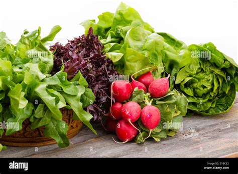 Healthy fresh salad ingredients displayed on old weathered wooden ...