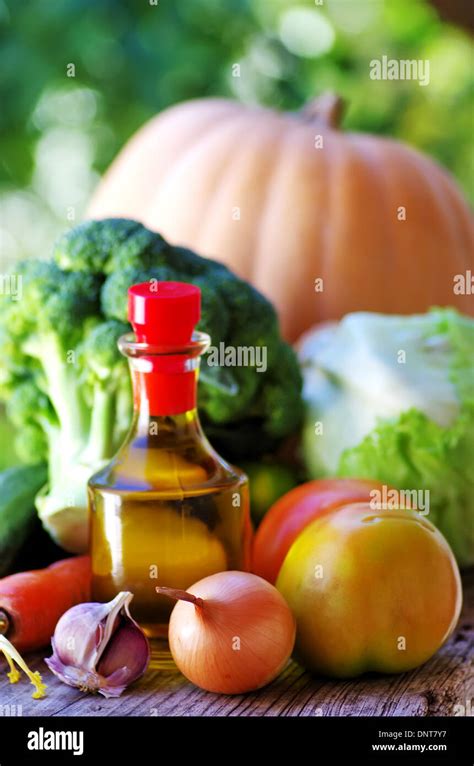 Olive oil and fresh vegetables Stock Photo - Alamy
