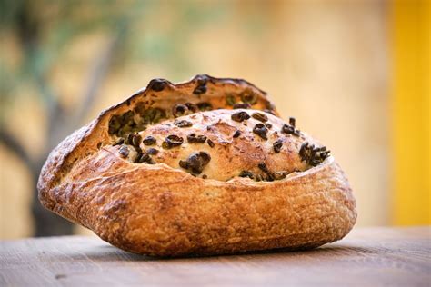 Delicious freshly baked rustic bread with olives - Free Photo (56GpBe ...