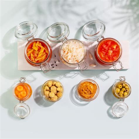Premium Photo | Fermented vegetables and mushrooms in glass jars