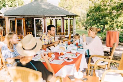 Premium Photo | High angle view of people eating food outdoors