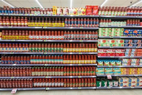 Canned Tomatoes on the Shelves of a Supermarket Editorial Photography ...