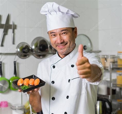 Asian chef on kitchen Stock Photo by ©upslim 105278962