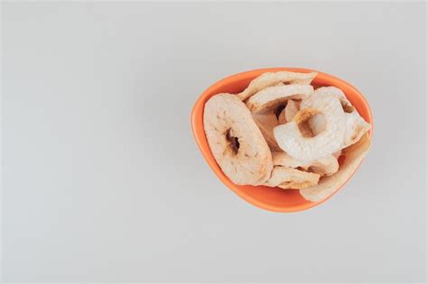 Free Photo | Dried fruit slices in orange bowl