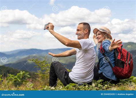 Portrait of Beautiful Young Couple Enjoying Nature at Mountain Peak ...