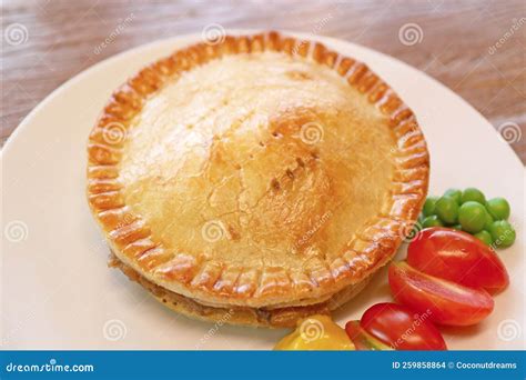 A Plate of Freshly Baked Golden Brown Meat Pie Stock Photo - Image of ...