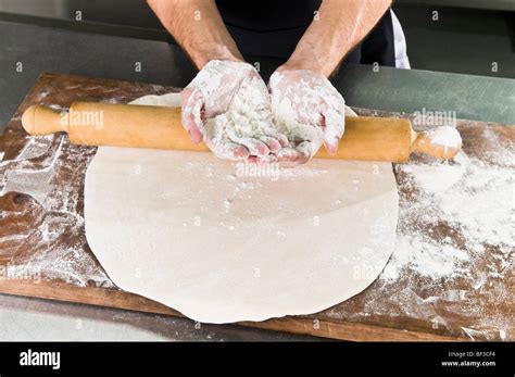 Chef's hands covered with flour Stock Photo - Alamy