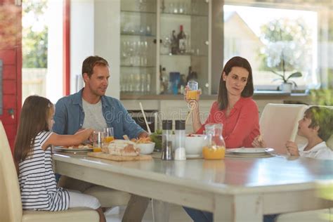 Catching Up Around the Table at Lunch. Shot of a Happy Family Enjoying ...