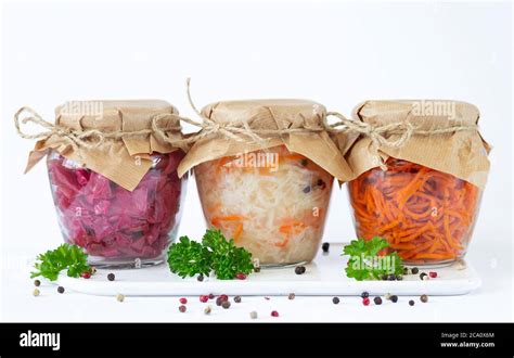 Pickled fermented vegetables in glass jars ready for eating Stock Photo ...