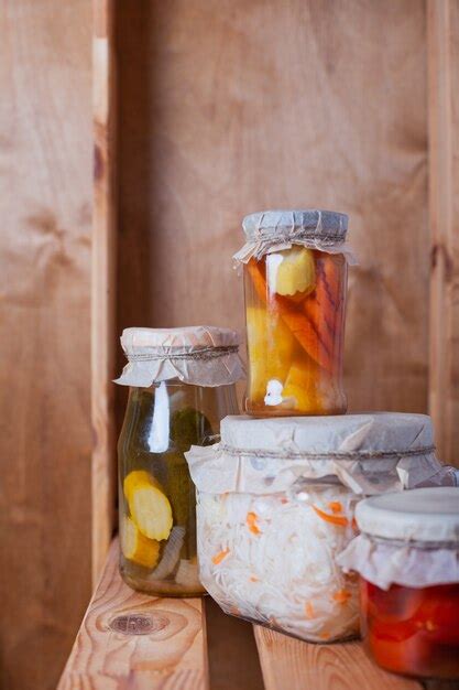 Premium Photo | Fermented vegetables in glass jars in the pantry