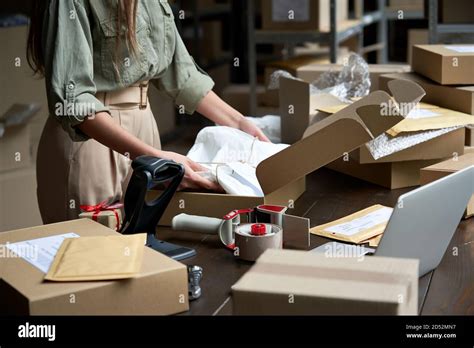 Online shop owner packing hi-res stock photography and images - Alamy