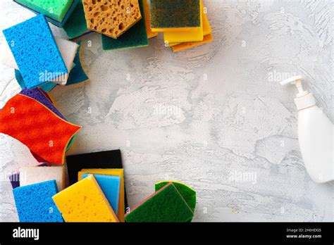 Pile of colorful cleaning sponges on gray background Stock Photo - Alamy
