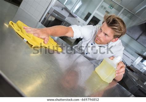 Male Cook Wiping Counter Top Kitchen Stock Photo (Edit Now) 669796852