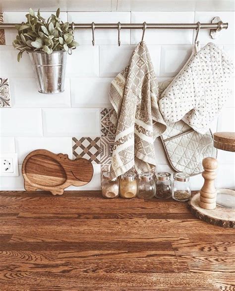 Rustic Kitchen Counter with Wooden Utensils and Potted Plants