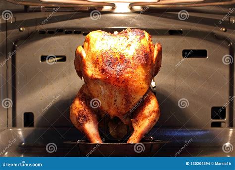 Roasted Chicken in the Oven Stock Photo - Image of baked, cook: 130204594