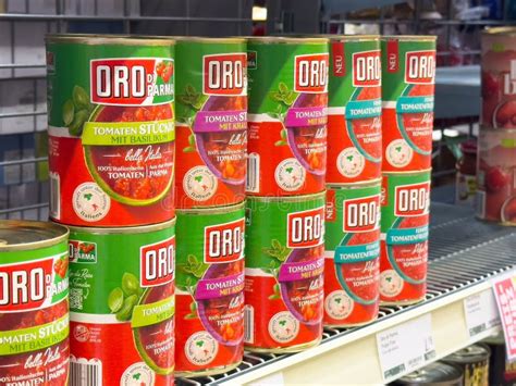 Assorted Canned Tomatoes with Basil on Supermarket Shelf Editorial ...
