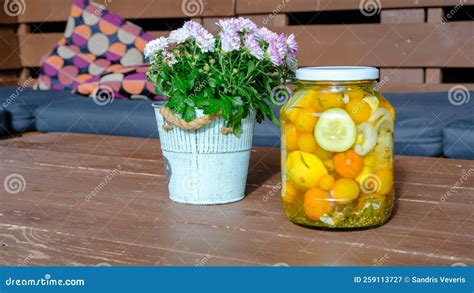 Canned and Preserved Tomatoes in a Glass Jar. Homemade Pickled ...