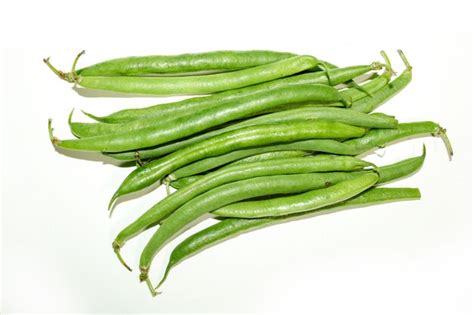Premium Photo | Pile of fresh green beans isolated on a white background