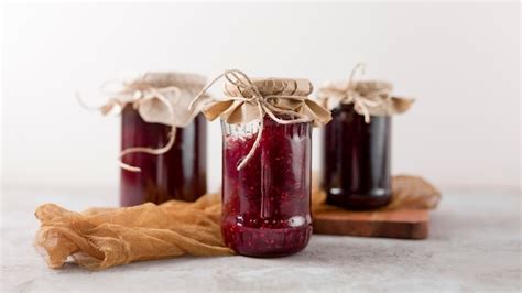 Premium Photo | Front view arrangement of homemade jam in jars