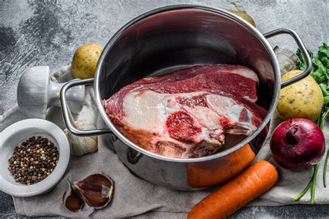 Pot with Veal on the Bone. Ingredients for Soup, Vegetables and Spices ...