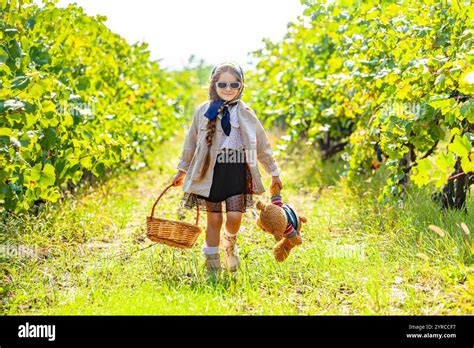 Little children eating lunch outdoors. Kids with picnic basket in ...
