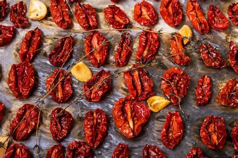 Oven-roasted Sundried Tomatoes on a Baking Sheet on Parchment Paper ...