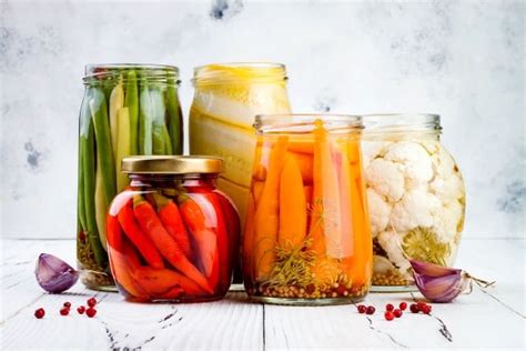How to preserve garden produce for healthy travel snacks on a rustic getaway?