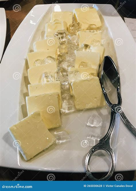 Pieces of Fresh Butter Placing on Ice in White Plate. Hotel Restaurant ...