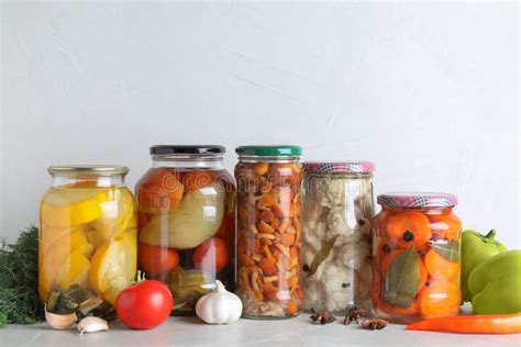 Fresh Vegetables and Jars of Pickled Products Stock Photo - Image of ...