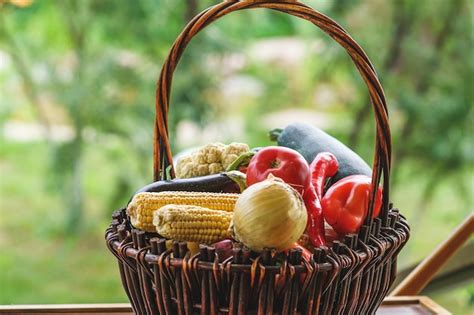 Premium Photo | Fresh vegetables in a basket in a summer garden in a ...