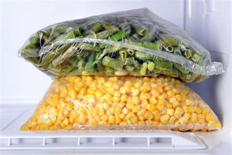 Premium Photo | Frozen vegetables in bags in freezer close up